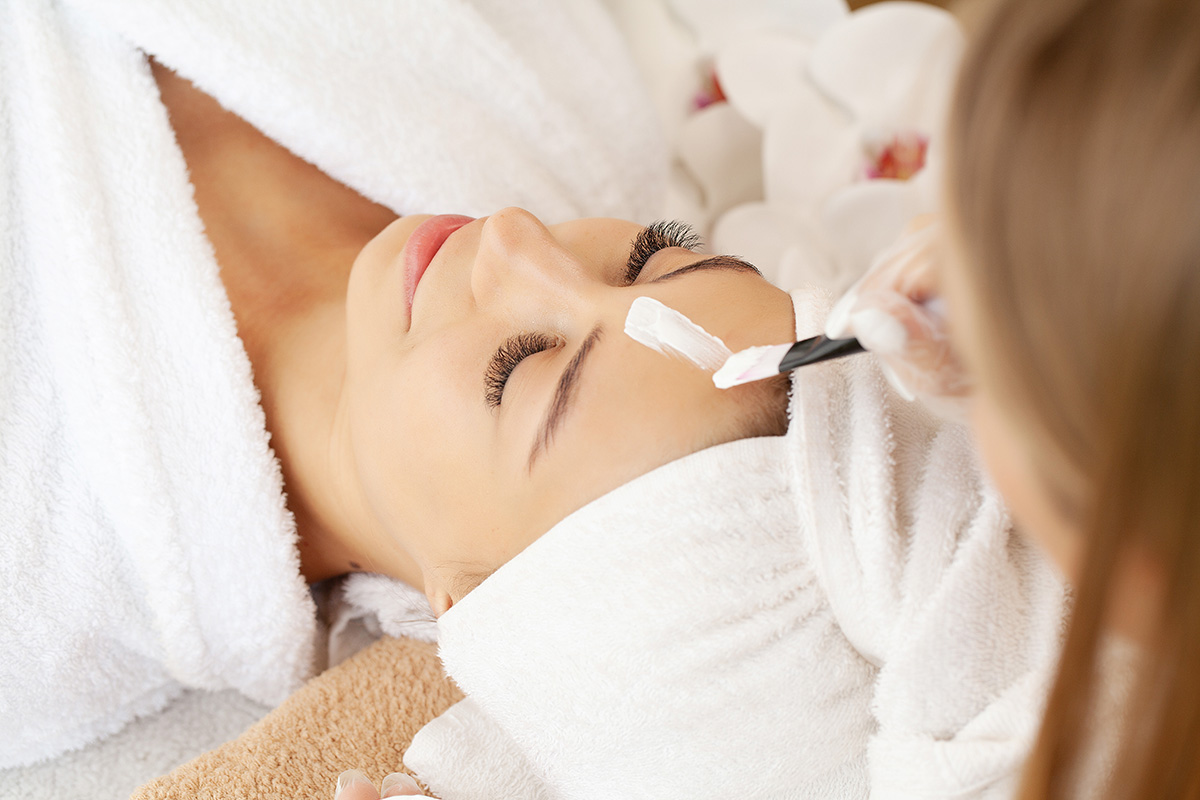 Woman in mask on face in spa beauty salon